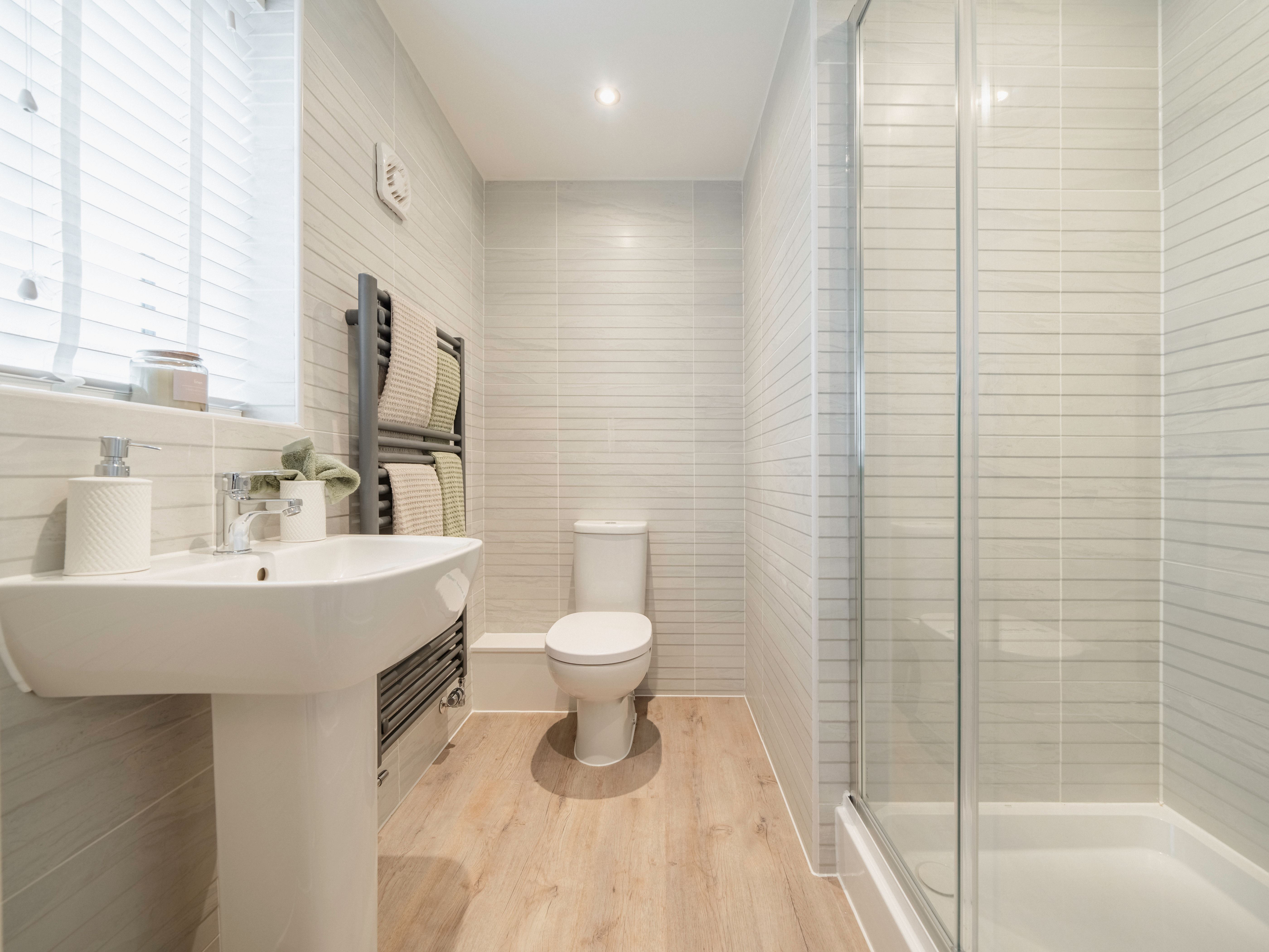 modern bathroom with shower and white tiles