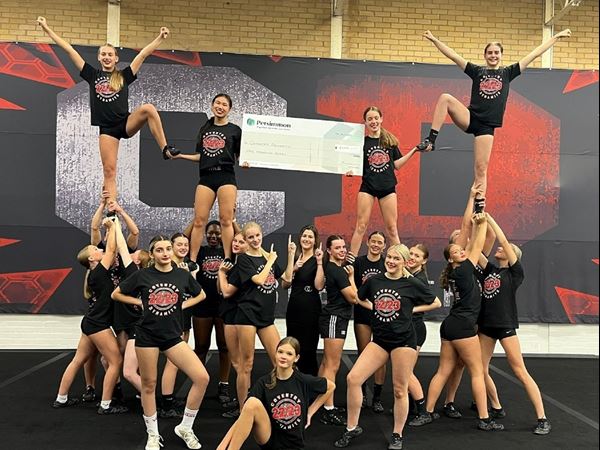 Coventry Dynamites Cheerleaders Receiving Donation