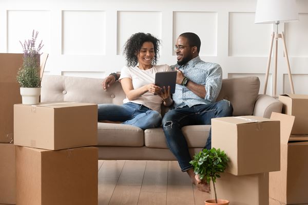 Couple Surrounded by Moving Boxes