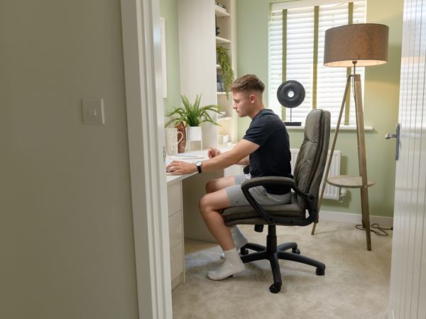 Man sitting at desk in Persimmon home office